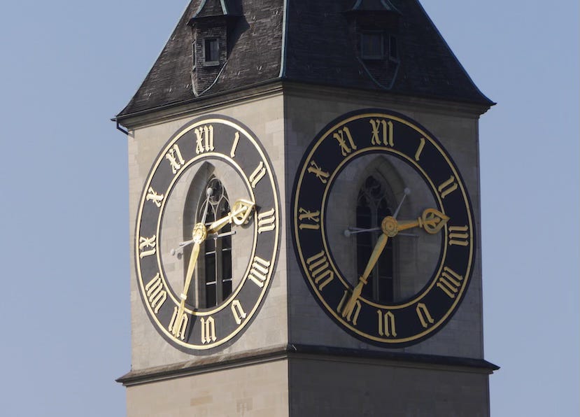 Photo by Author — what would I change? A close up of a large clock face on top of a church tower. The clock face has roman numeral and the sky is blue.