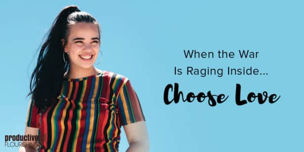 A woman with long dark hair in a ponytail, wearing a colorful, striped shirt against a blue background. Text Overlay: When The War Is Raging Inside... Choose Love.