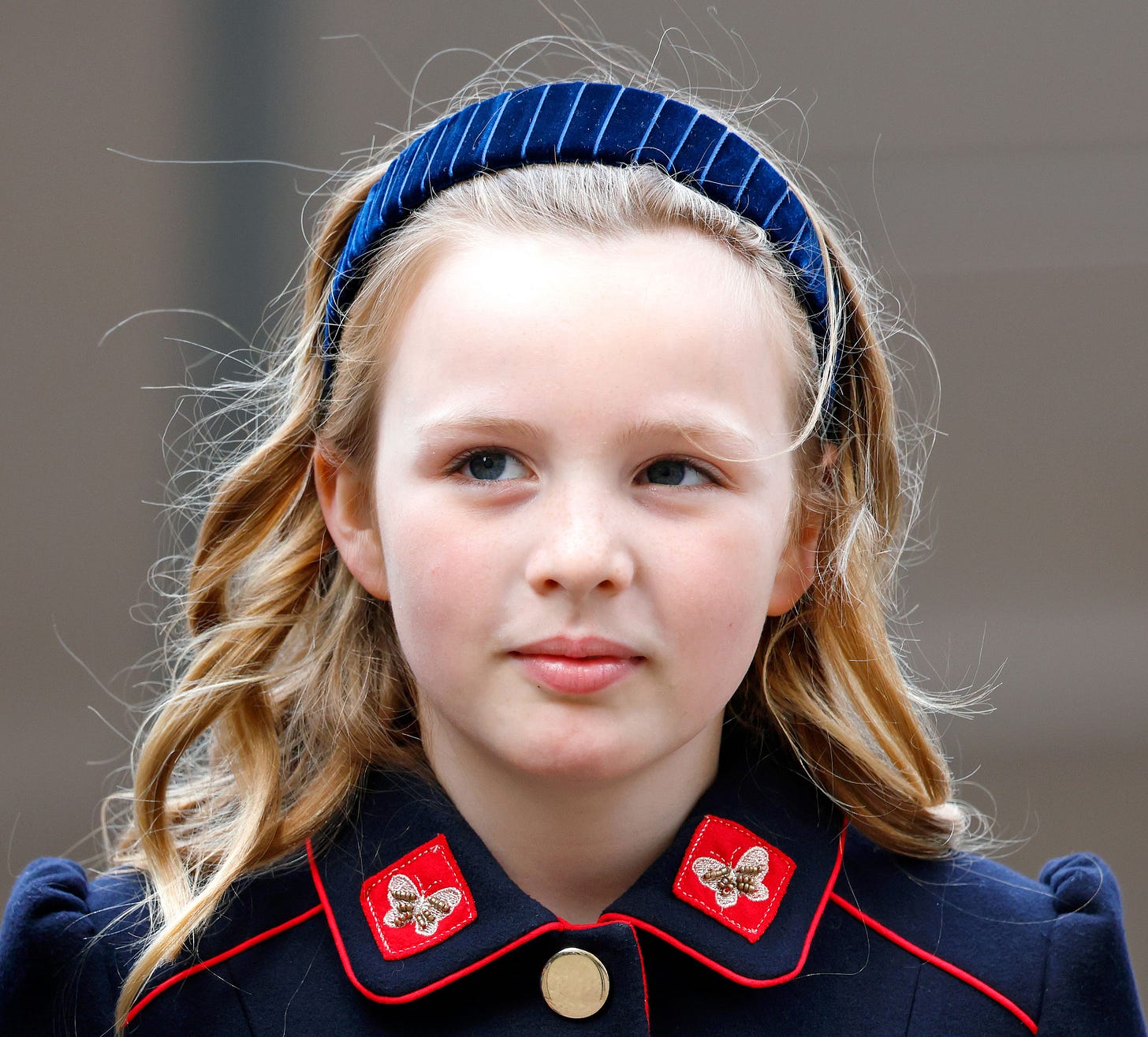 Mia Tindall dressed in a coat walking to Westminster Abbey