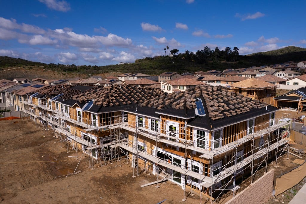Drone view of single-family homes under construction in rural San Marcos, California