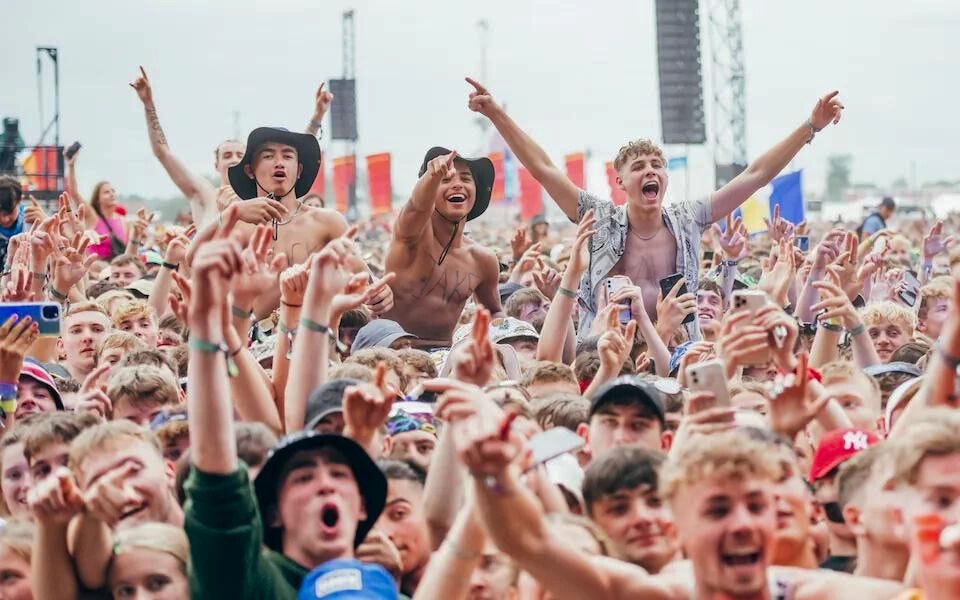 Crowd of revelers, mostly male, at festival