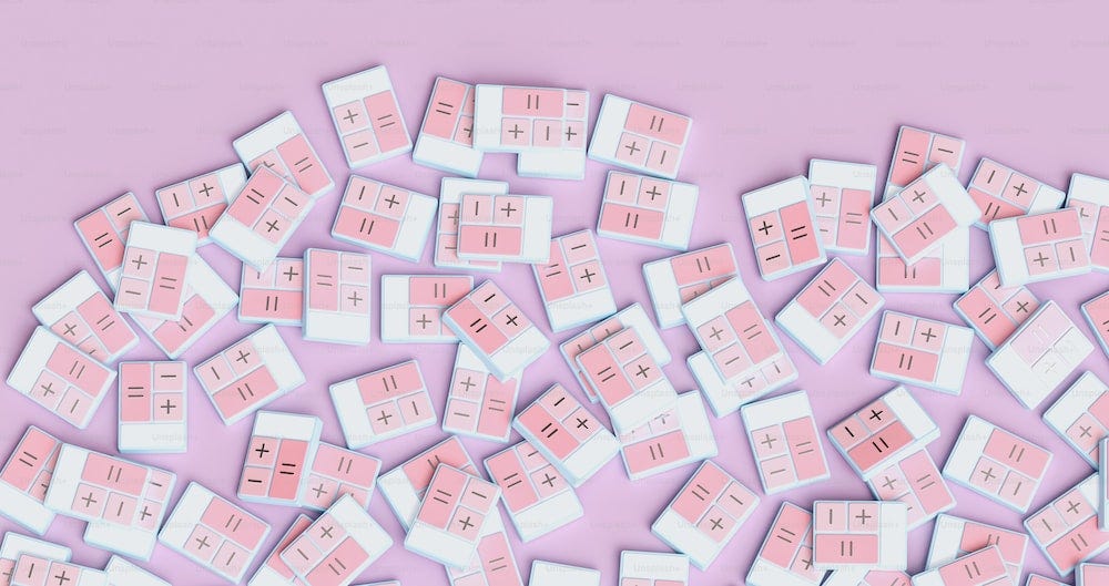 a pile of pink and white squares on a pink background