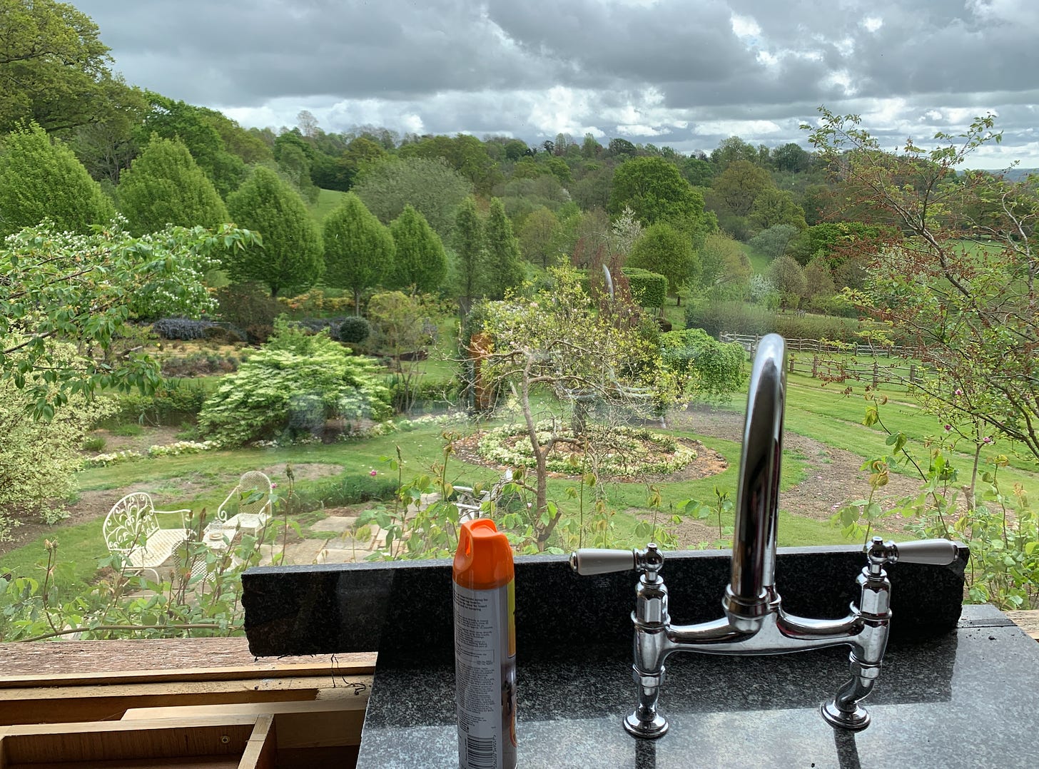 a garden viewed from the kitchen sink 