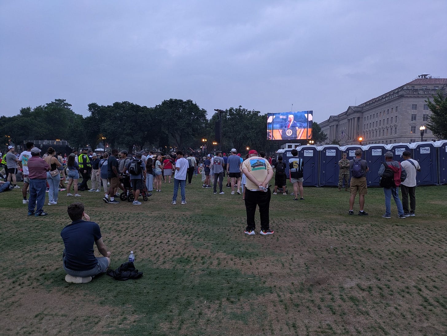 President Donald Trump's speech was displayed on large screens as people watched near the Washington Monument at the conclusion of the Army parade on June 14, 2025. (Photo by Ashley Murray/States Newsroom) President Donald Trump's speech was displayed on large screens as people watched near the Washington Monument at the conclusion of the Army parade on June 14, 2025. (Photo by Ashley Murray/States Newsroom)