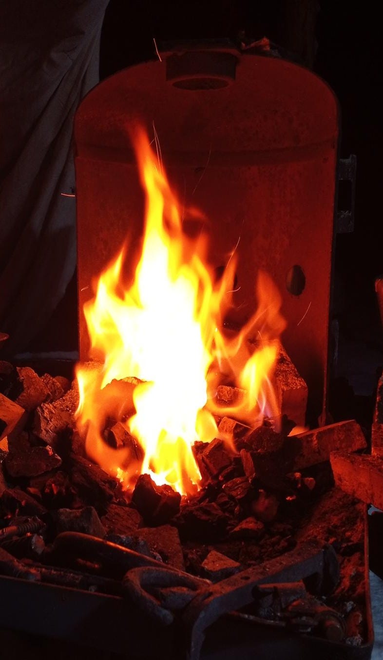 A blazing hot charcoal fire.