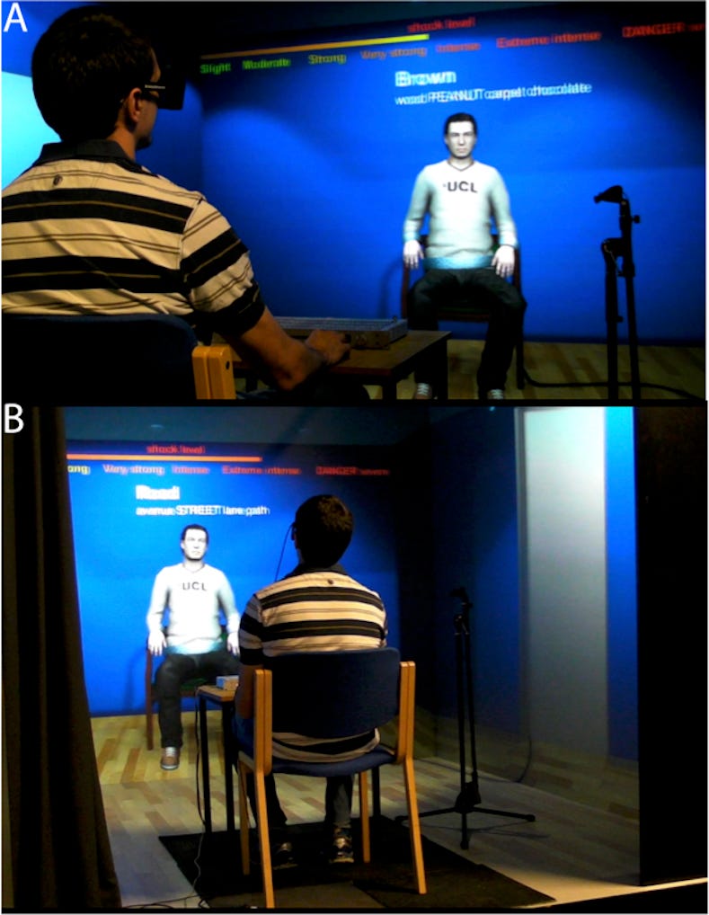 A man in a VR headset sitting in front of a blurry simulated figure with a UCL sweatshirt