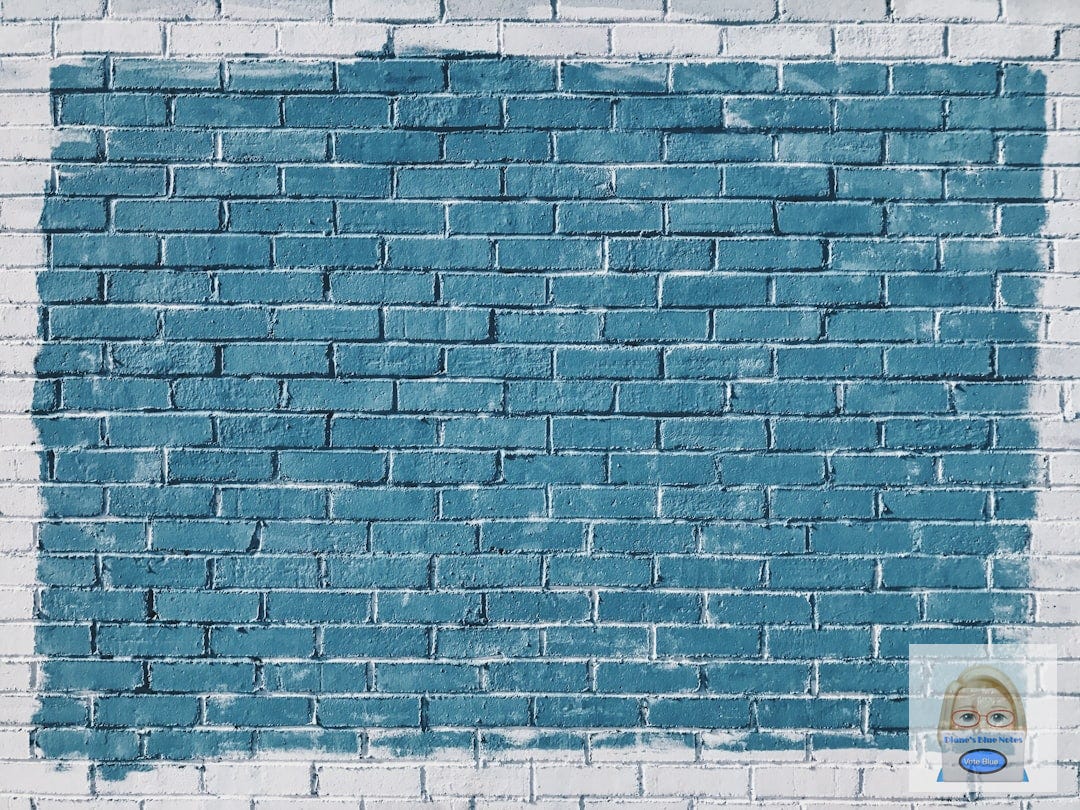 gray concrete bricks painted in blue