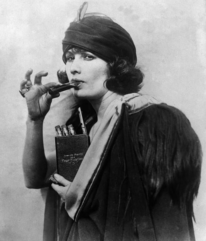 A Prohibition era woman drinking from a flask disguised as a book 