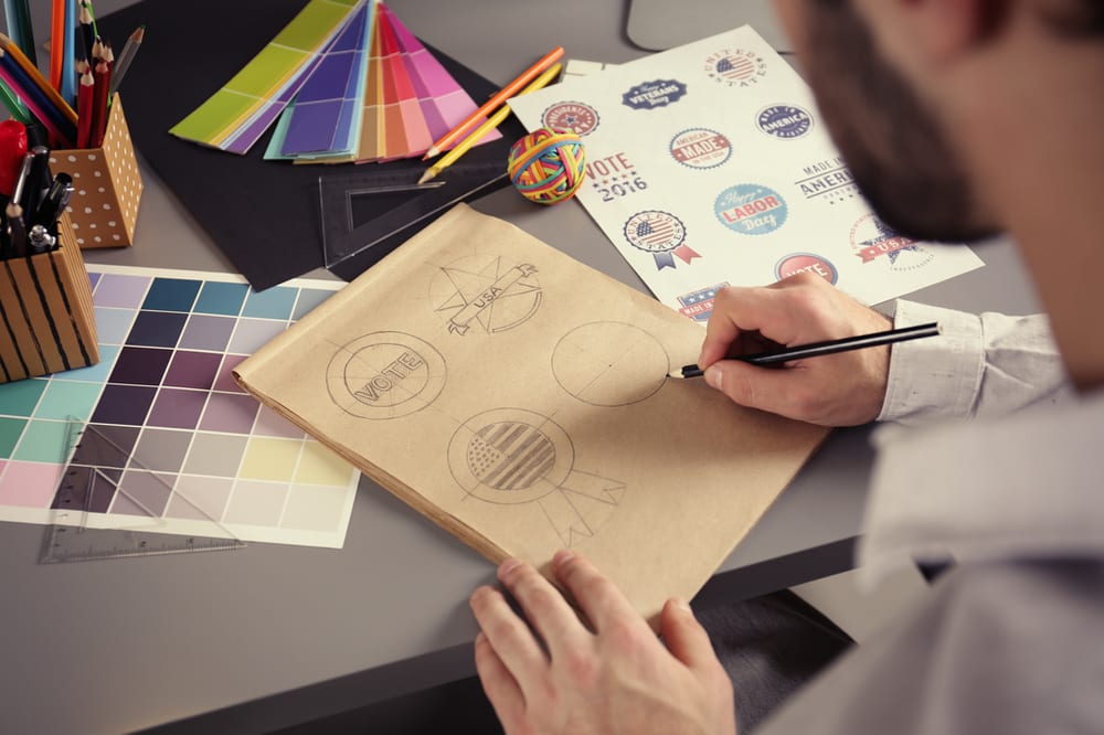 Logo designer drawing it out