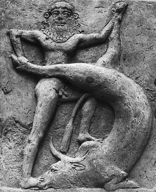 This may contain: an ancient stone carving with a man kneeling on the ground