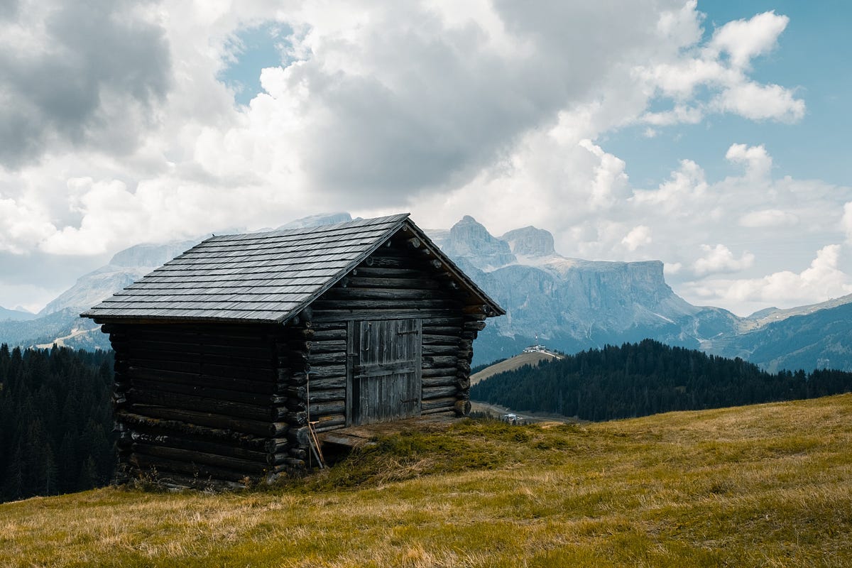 Remote wooden house standing in the hills