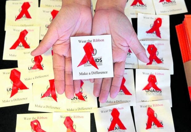 Red Ribbon campaign for awareness on acquired immunodeficiency syndrome (AIDS), the most severe stage of HIV infection