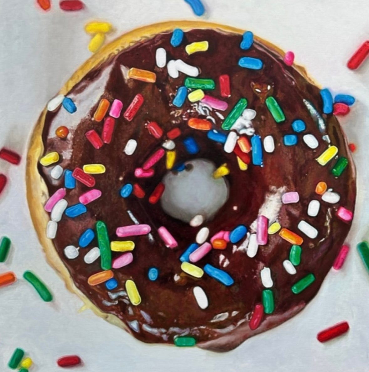 A chocolate donut with sprinkles

Description automatically generated