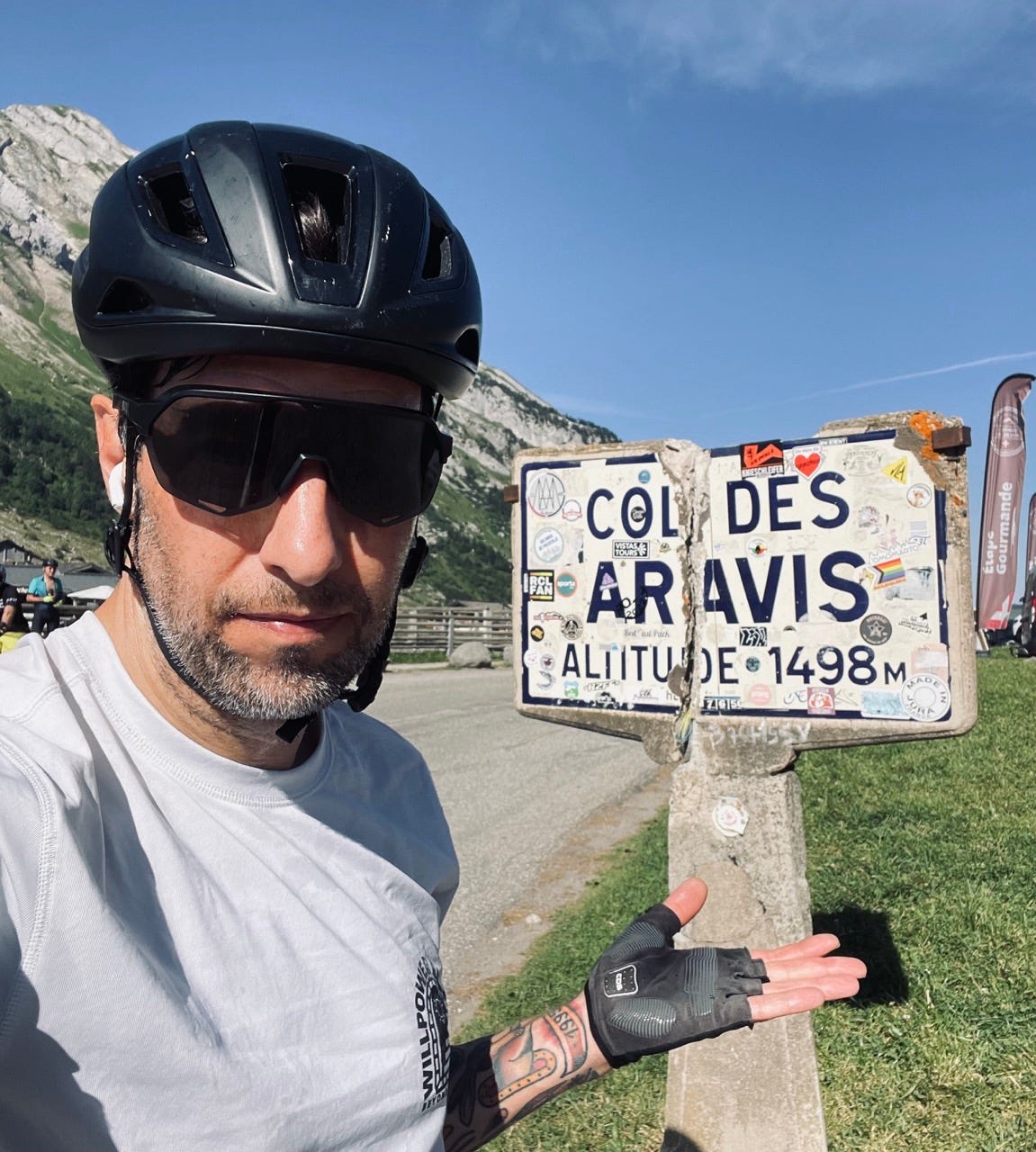 The author in front of a sign of Col Des Aravis