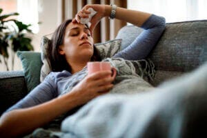 Sick woman on couch. Courtesy of UCSF