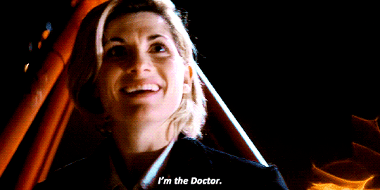 This GIF (repeated moving image) sees Jodie Whittaker's Thirteenth Doctor, at the climax of Doctor Who Series 11's premiere episode ("The Woman Who Fell to Earth"), telling her offscreen nemesis T'zim-Sha who she is. The words "I'm the Doctor" appear below Thirteen's smiling face. This GIF (repeated moving image) sees Jodie Whittaker's Thirteenth Doctor, at the climax of Doctor Who Series 11's premiere episode ("The Woman Who Fell to Earth"), telling her offscreen nemesis T'zim-Sha who she is. The words "I'm the Doctor" appear below Thirteen's smiling face.