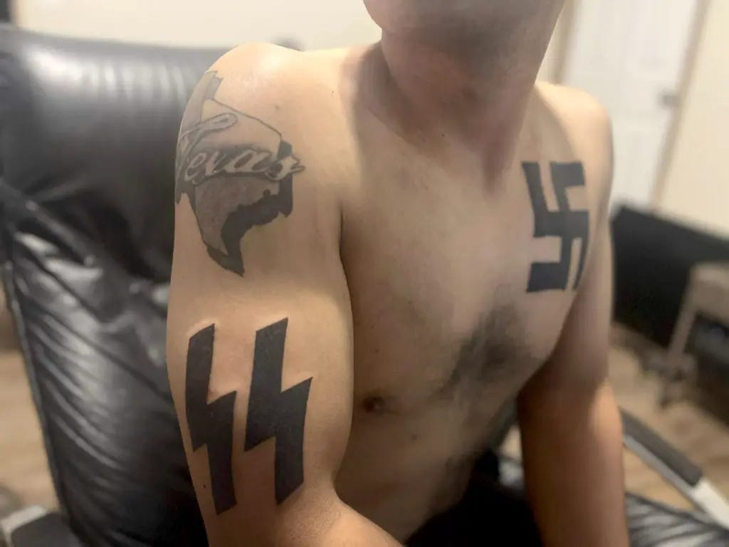 Online pictures showed him as having Nazi tattoos.