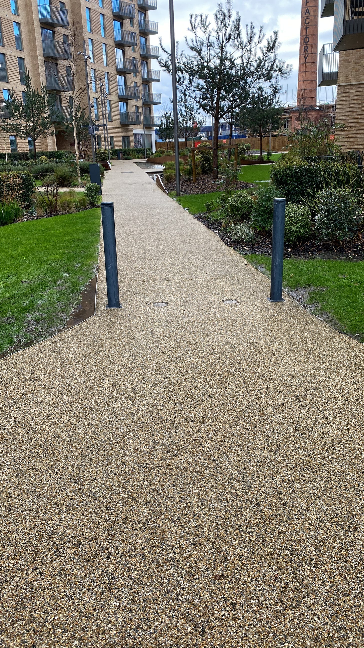 Image of bollards that have been readjusted to be much wider so they are accessible now.