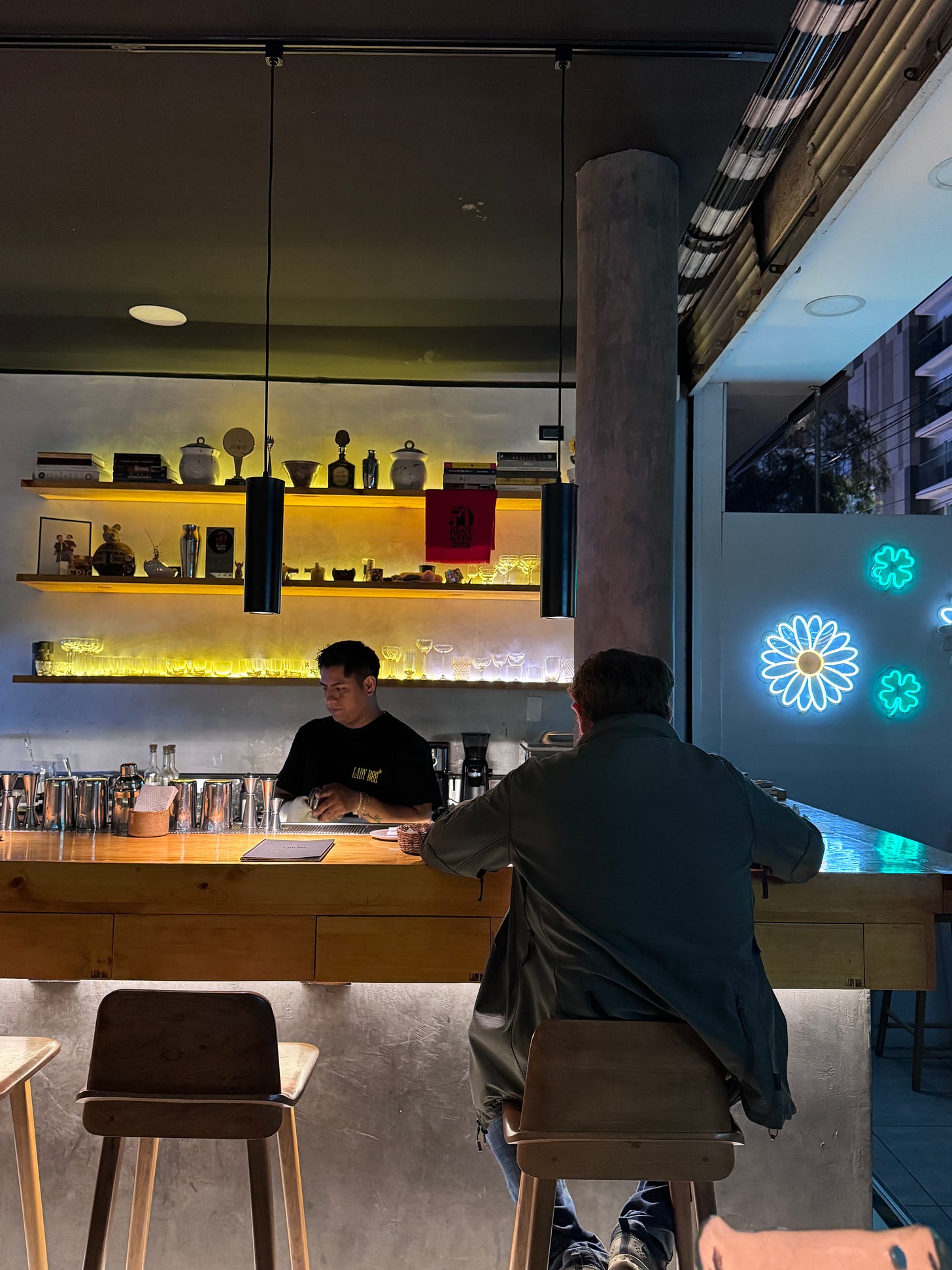 Man sitting at the bar counter in Lady Bee Lima