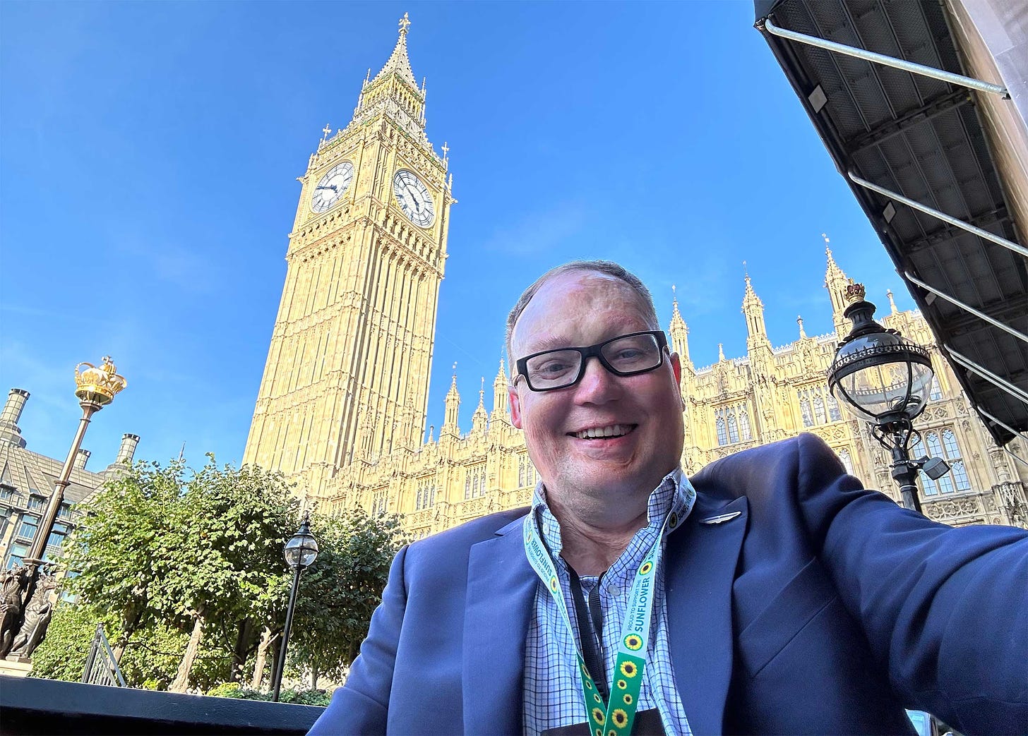 John taking a selfie in front of the Big Ben clock tower.