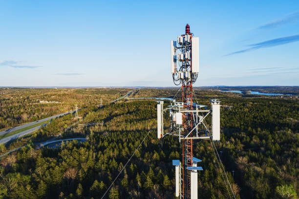 Communications Tower Aerial drone view of a communications tower. 5g tower stock pictures, royalty-free photos & images