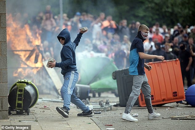 Anti-migration protesters riot outside the Holiday Inn Express in Manvers, Rotherham, on August 4