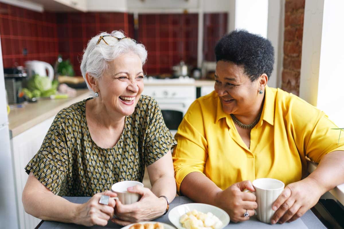 Women enjoying a cup of tea together while catching up on life.