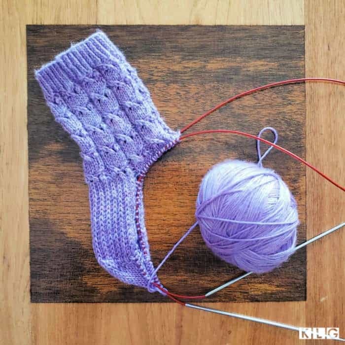 Fairy Maiden Socks Progress. Stitches arranged on the needles in magic loop, to start the gusset decrease stitches.