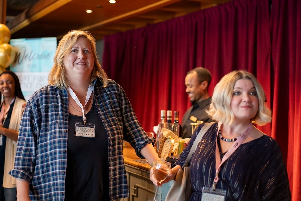 Bridget Everett and Mary Catherine Garrison on the set of Somebody Somewhere with a red curtain in the background