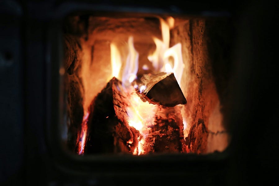 A brightly lit fireplace A brightly lit fireplace