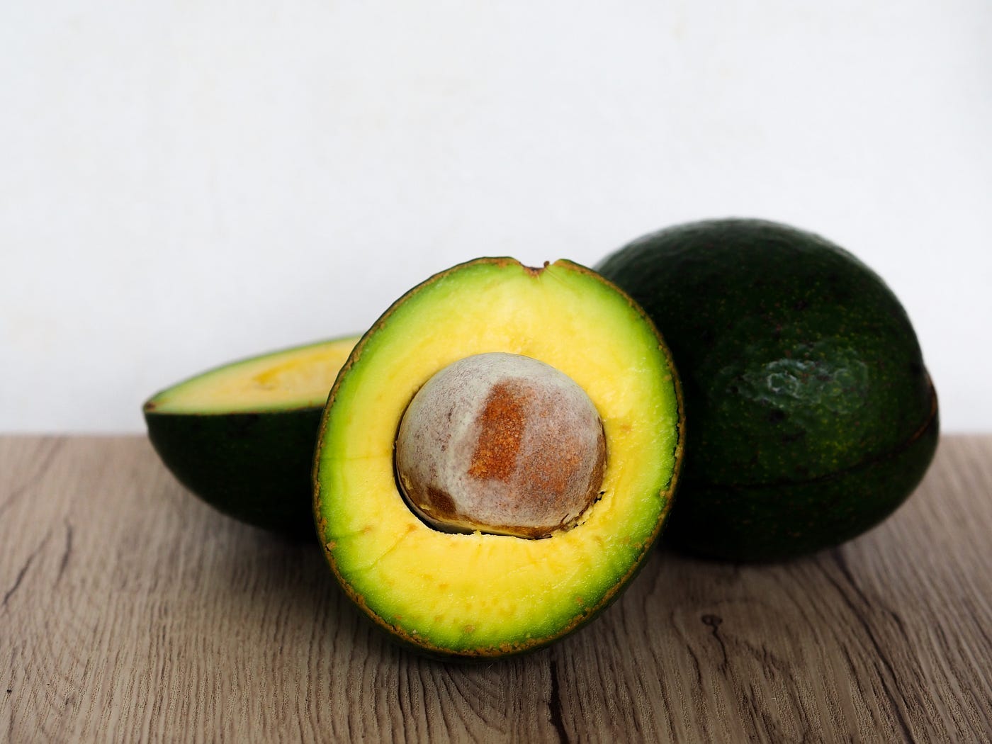avocado cut open on a cutting board