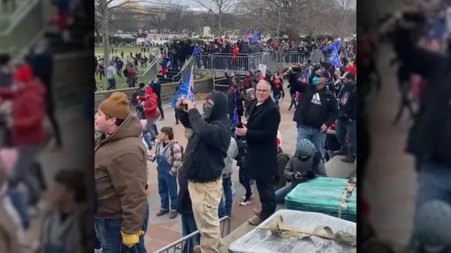 A video posted to Parler shows Texas State Representative Kyle Biedermann standing near the steps of the U.S. Capitol around 1 p.m. on January 6, 2021.