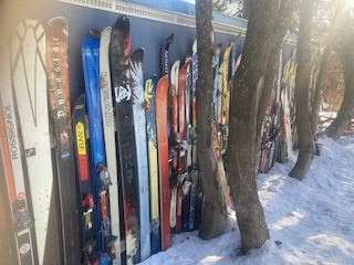A line of retired skis form a fence in Rossland BC