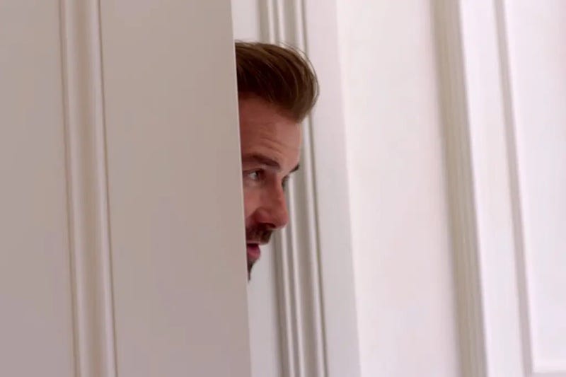 David Beckham Netflix docu sticking his head through a crack in a door