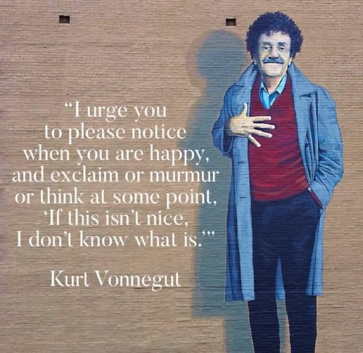 A painting of Kurt Vonnegut, who has dark curly hair and a mustache. Next to it is a quote: “I urge you to please notice when you are happy, and exclaim or murmur or think at some point, ‘If this isn’t nice, I don’t know what is.’”