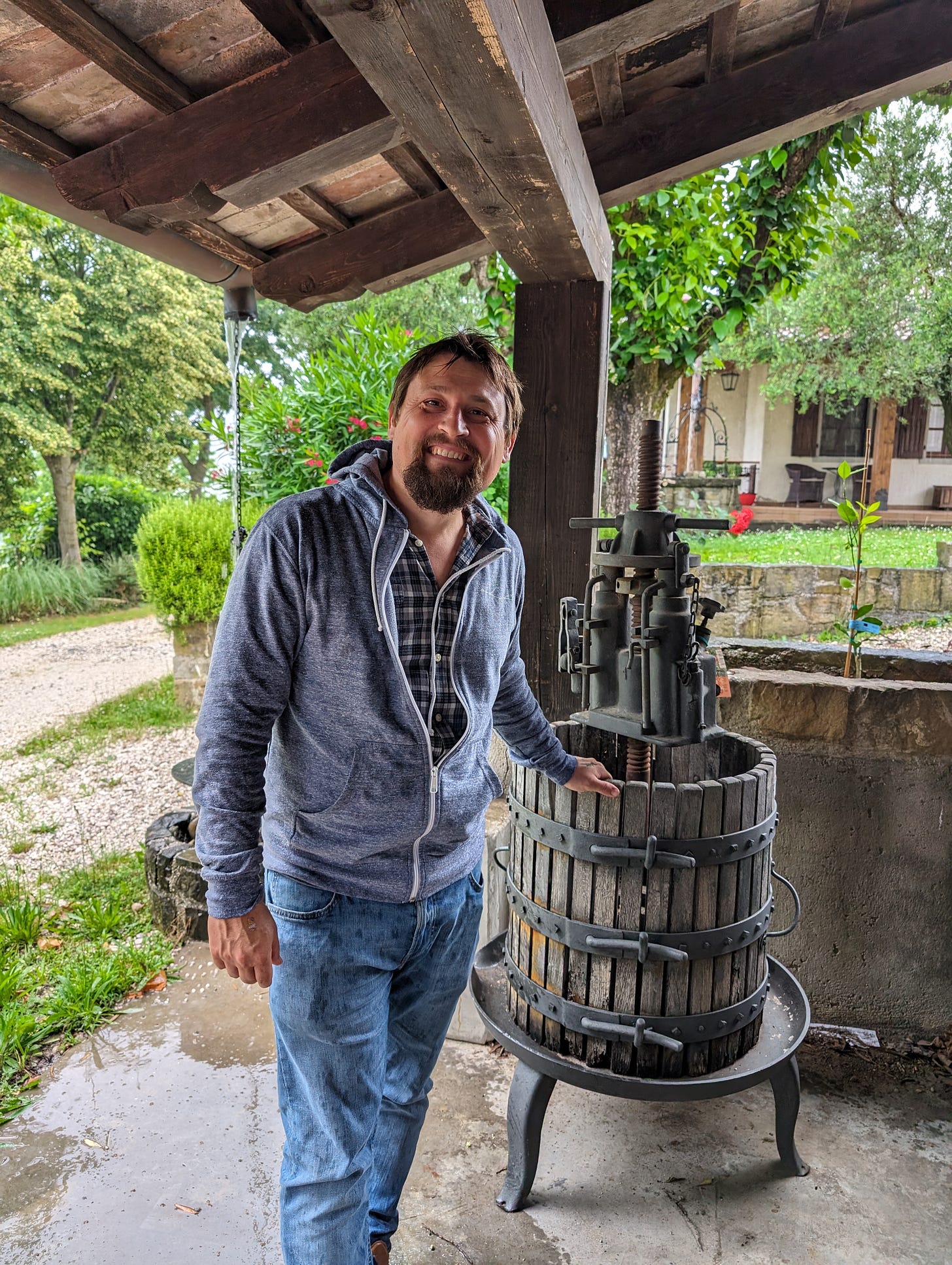 Kristian Keber with the tiny press he used to make his first wine in 2003. Photo (C) Simon J Woolf.