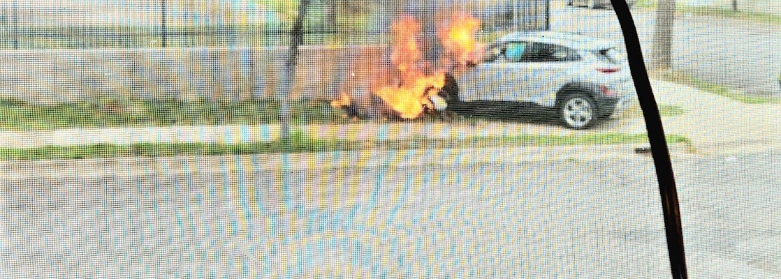 A car in flames.