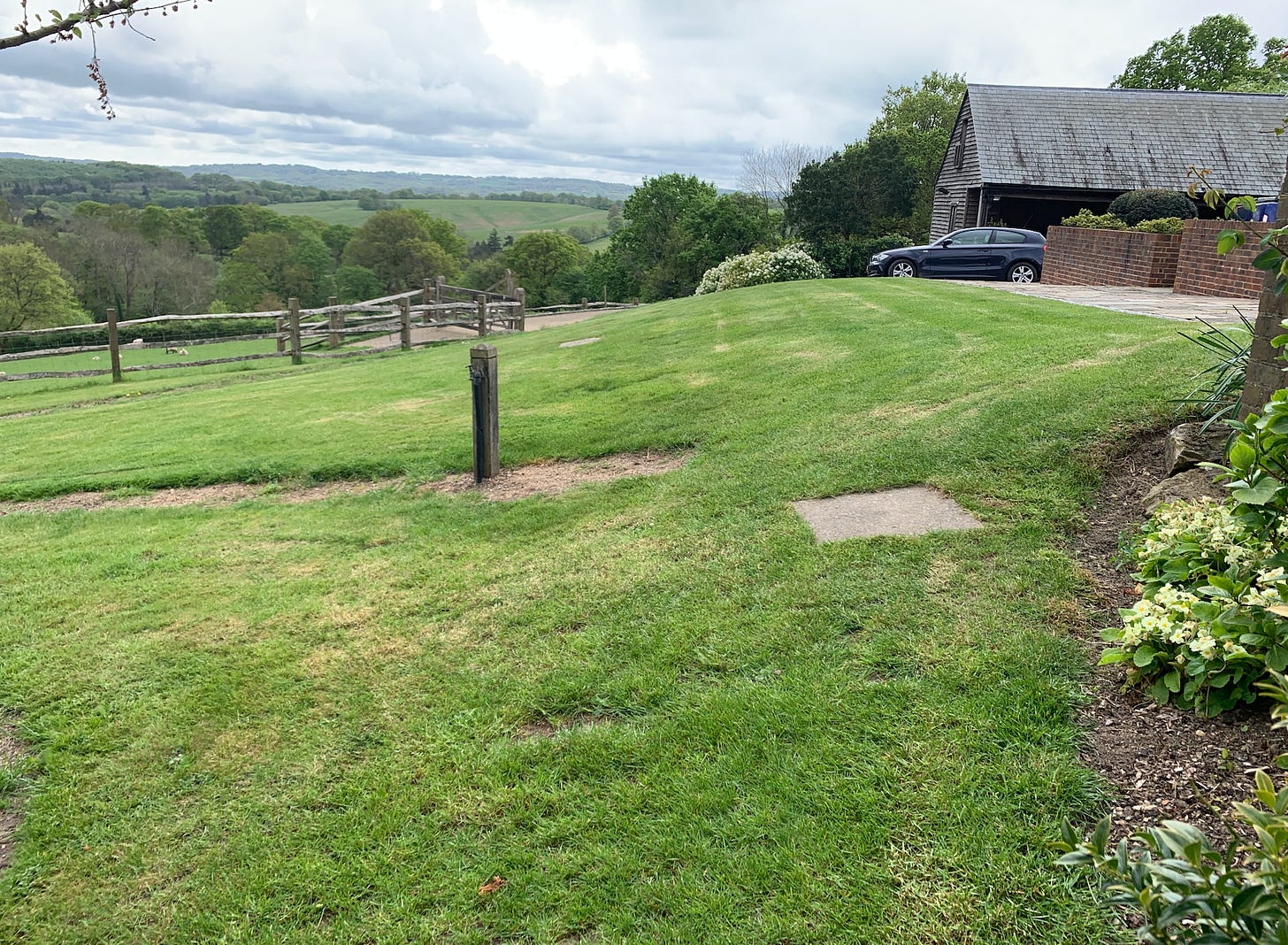 a barn in a sloping garden