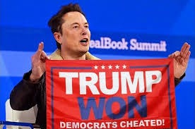 Elon Musk holding a flag that says "Trump Won, Democrats Cheated." |  Download Scientific Diagram