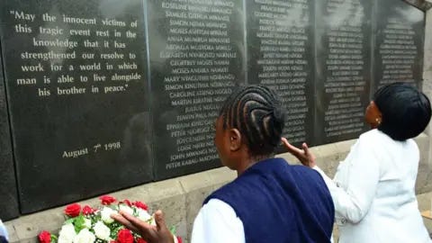 Getty Images People praying at a amemorial