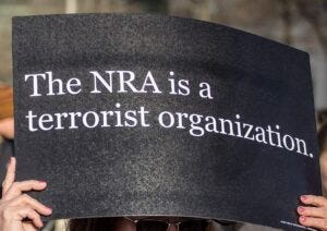 "Hundreds of thousands of people gathered in Washington, DC for the March for Our Lives rally, protesting gun violence and demanding action by elected officials to enact common sense gun control laws" by Phil Roeder from Des Moines, IA, USA via March for Our Lives