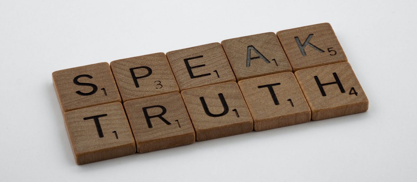 letter blocks spelling out "speak truth"