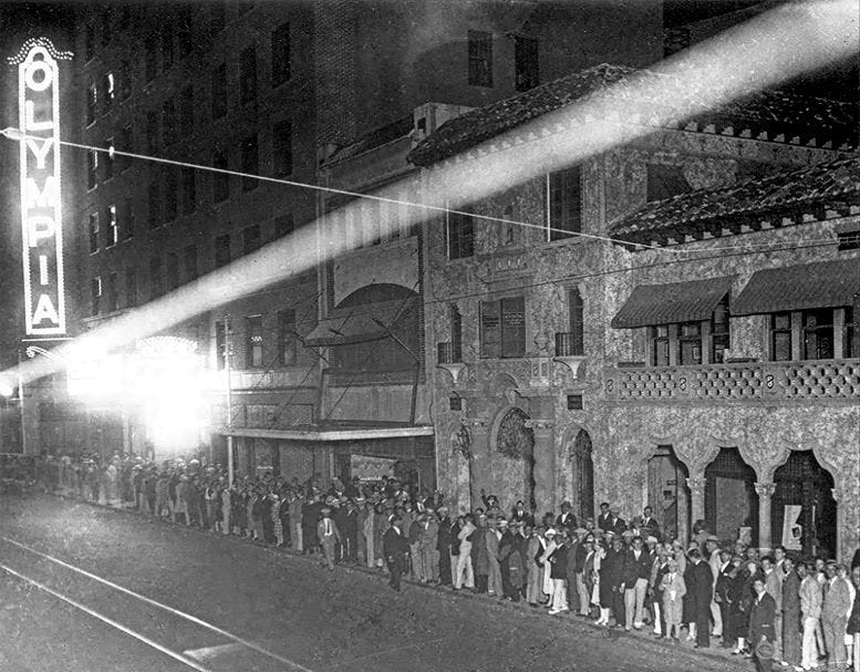 A line of people waiting to get into the Olympia Theater on the evening of February 18, 1926.