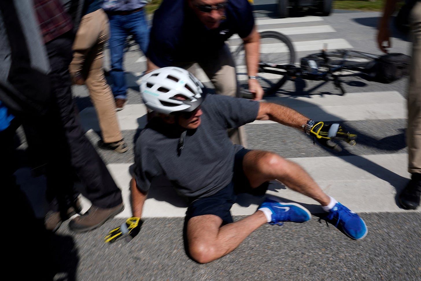 Biden falls after flubbing bike dismount, but uninjured ...