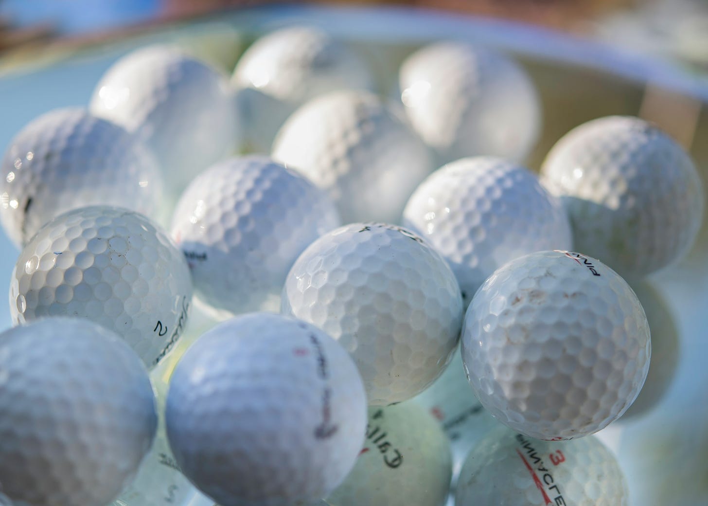 close up of white golf balls