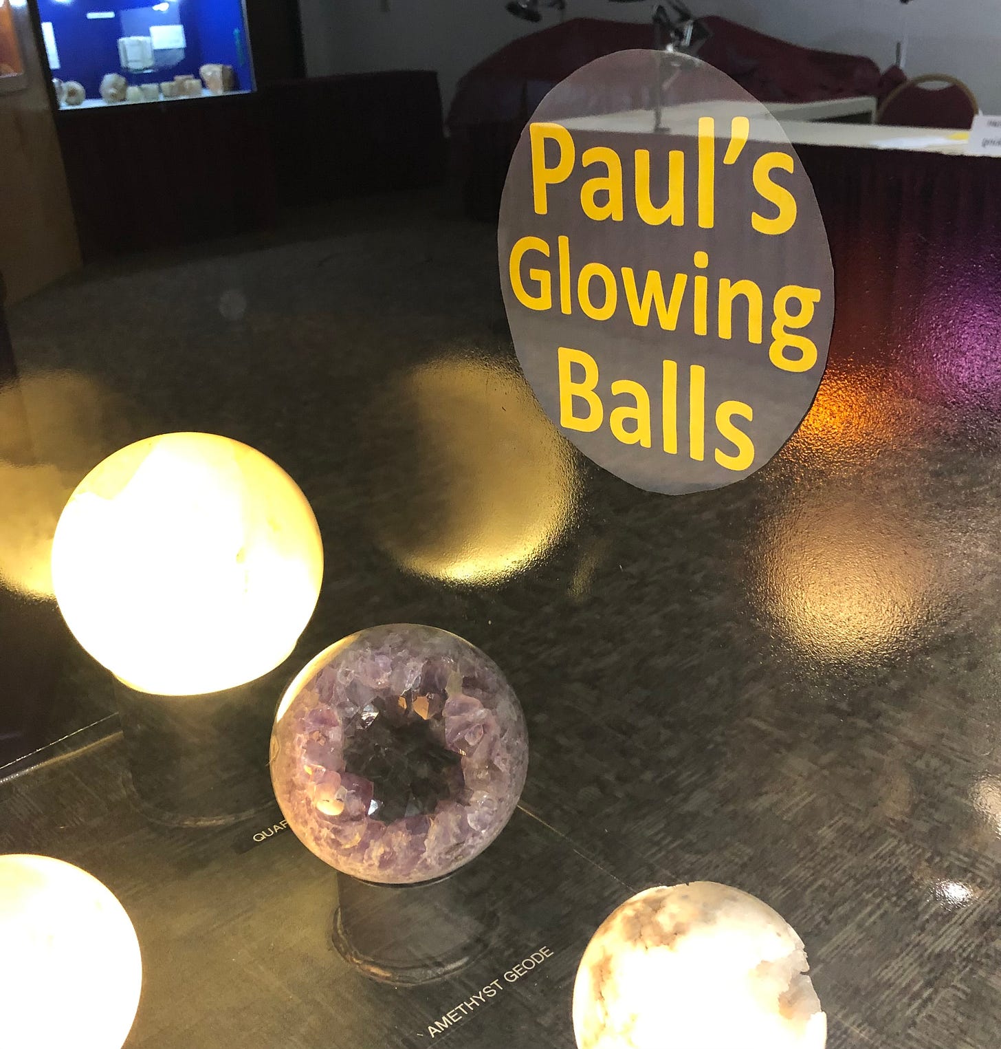 A display of geodes that are lighted from the inside entitled “Paul’s Glowing Balls”.