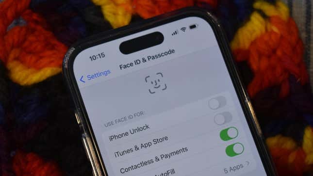 An iPhone 14 Pro with the Settings open showing Face ID & Passcode