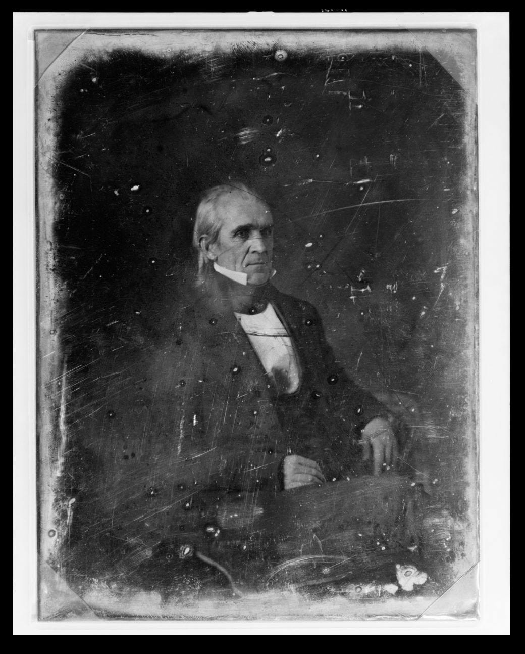 James Knox Polk, three-quarter length portrait, three-quarters to the right, seated.