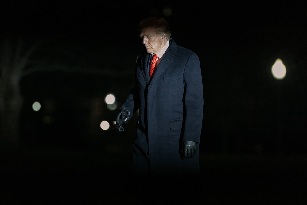 Donald Trump walks across the South Lawn of the White House.