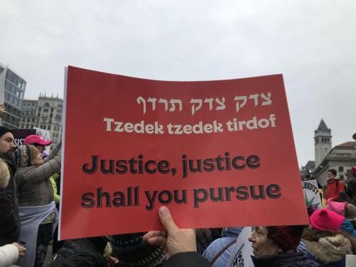 Jewish women marching at the Women’s March 2019 on Jan. 19, 2019. with a sign that reads Tzedek Tzedek Tirdof, Justice, Justice you shall pursue | Photo / Marcy Caplin